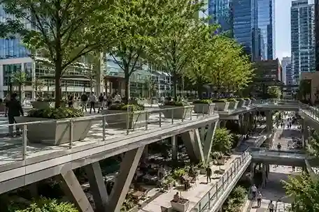 Multi-level elevated pedestrian plaza with structural tree planters in New Eastside Chicago